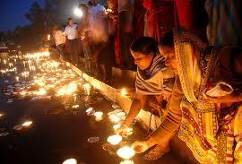 Pilgrims lighting lamps at Kolayat holy lake
